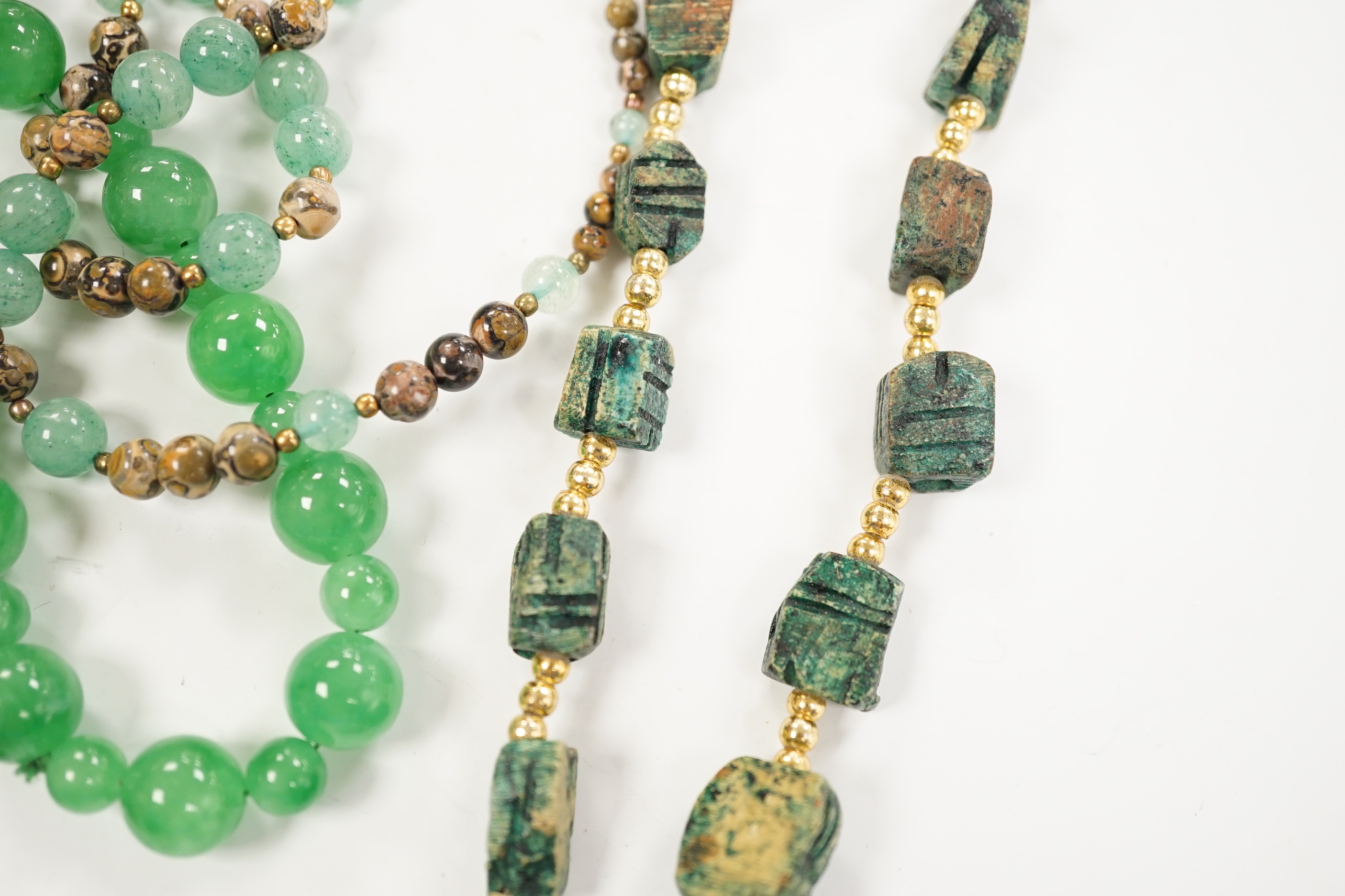 Three assorted Chinese bead necklaces including filigree gilt white metal and enamel pendant necklace, overall 68cm and a jade bracelet.